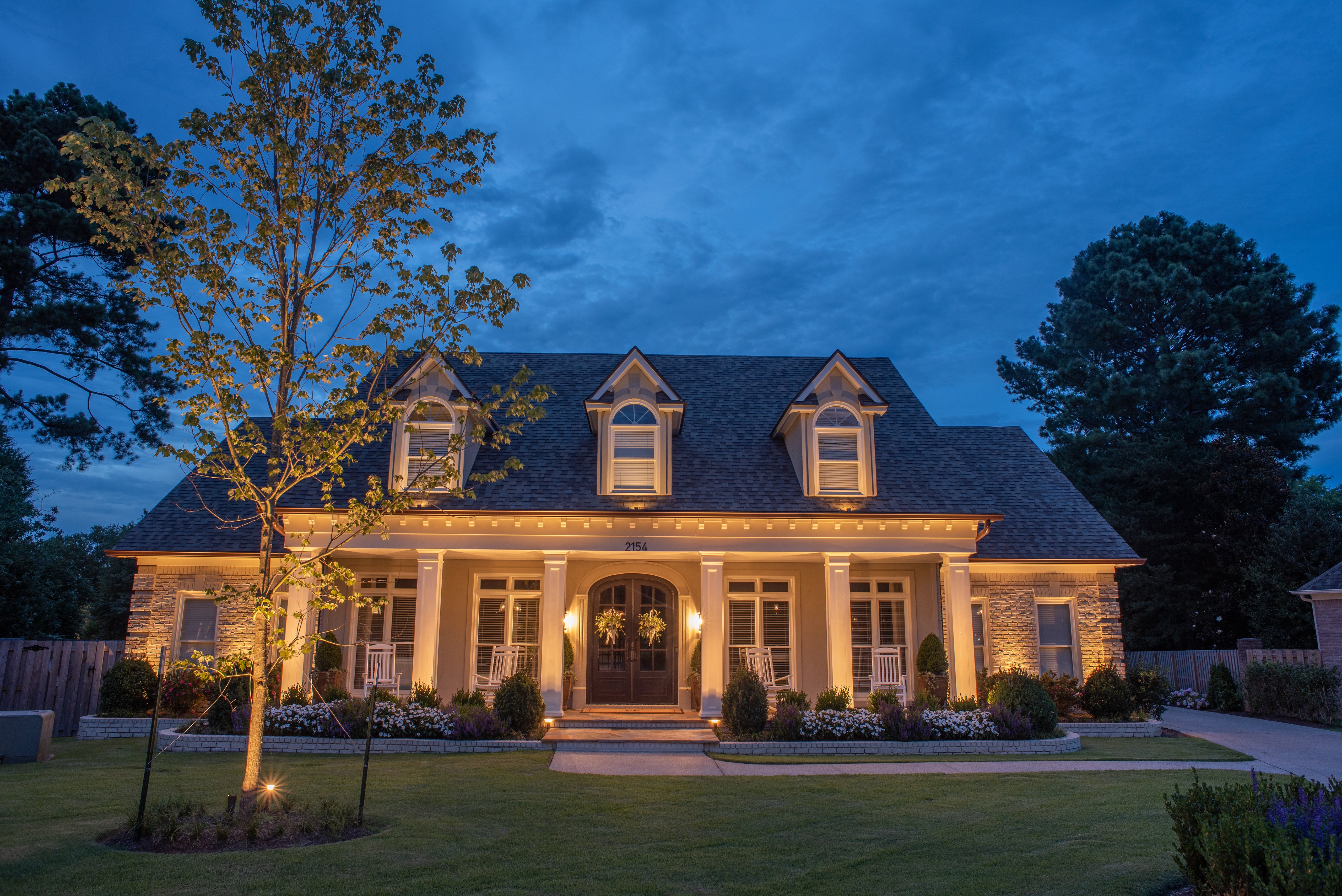 front of house with outdoor lights