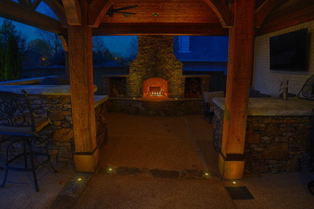 Casello backyard fireplace with outdoor zoned lighting