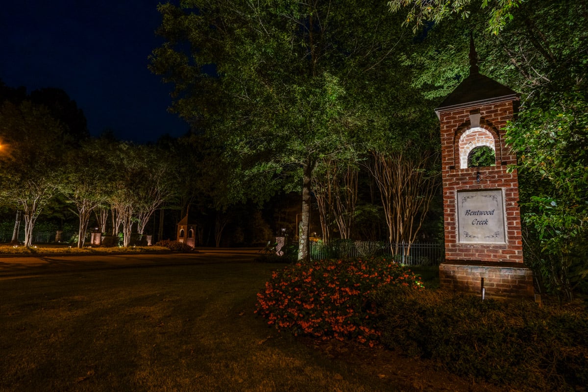 Commercial landscape lighting neighborhood entrance sign uplighting 