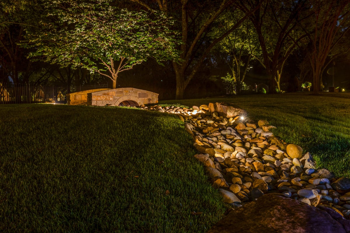 Residential bridge pathway tree uplighting