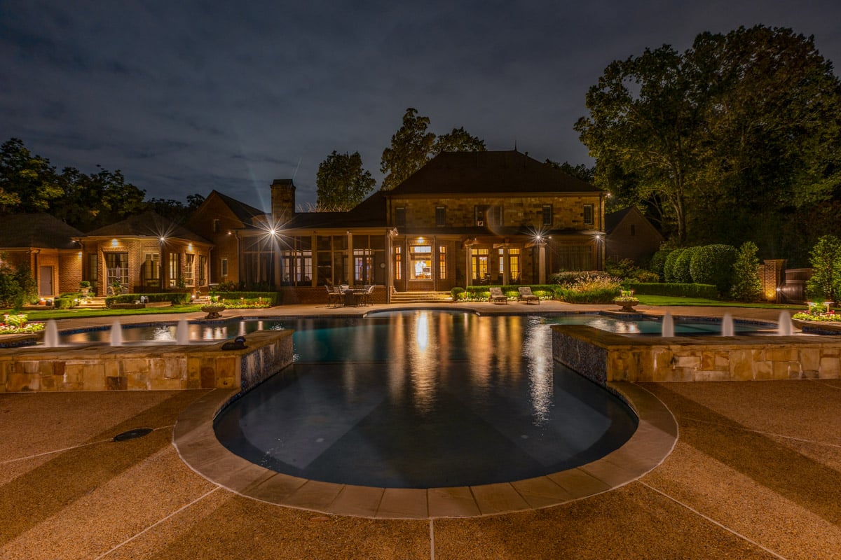 Residential landscape pool lighting back of house