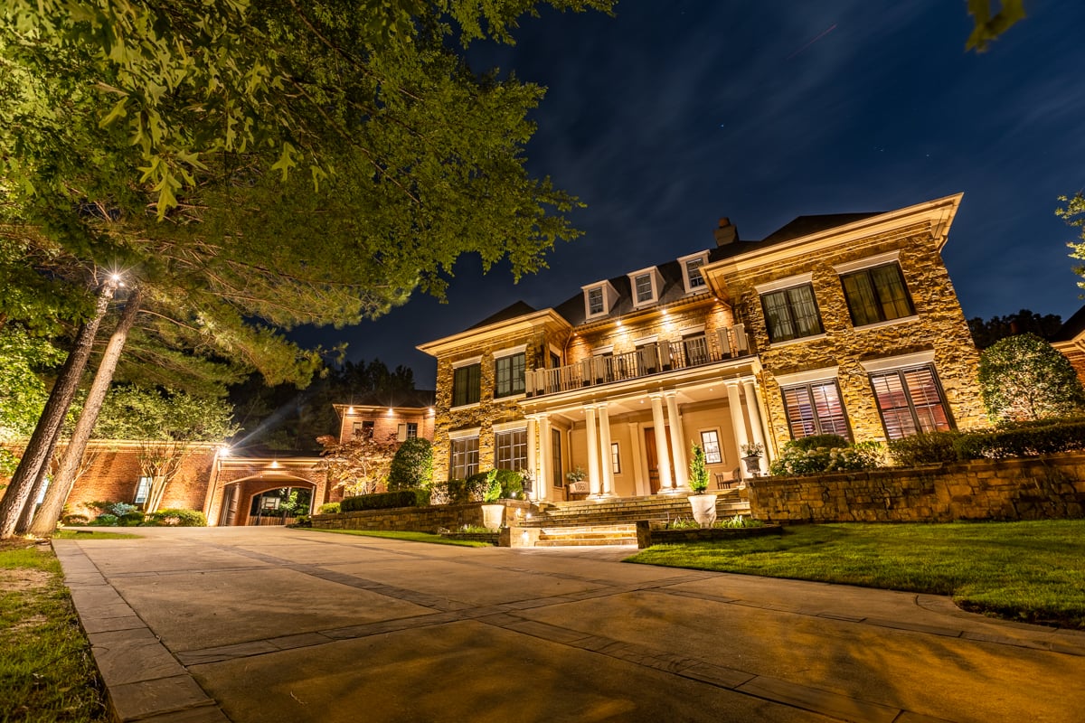 House with exterior LED landscape lighting