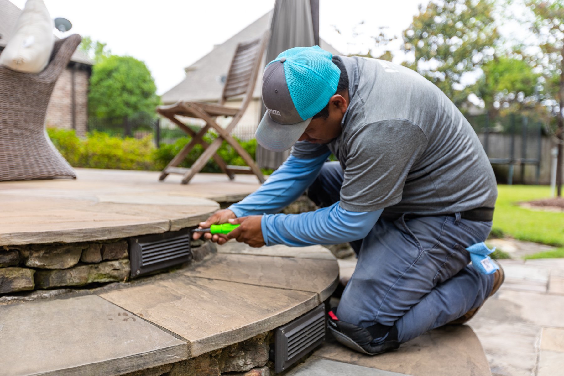 outdoor landscape lighting installation team installing step lighting