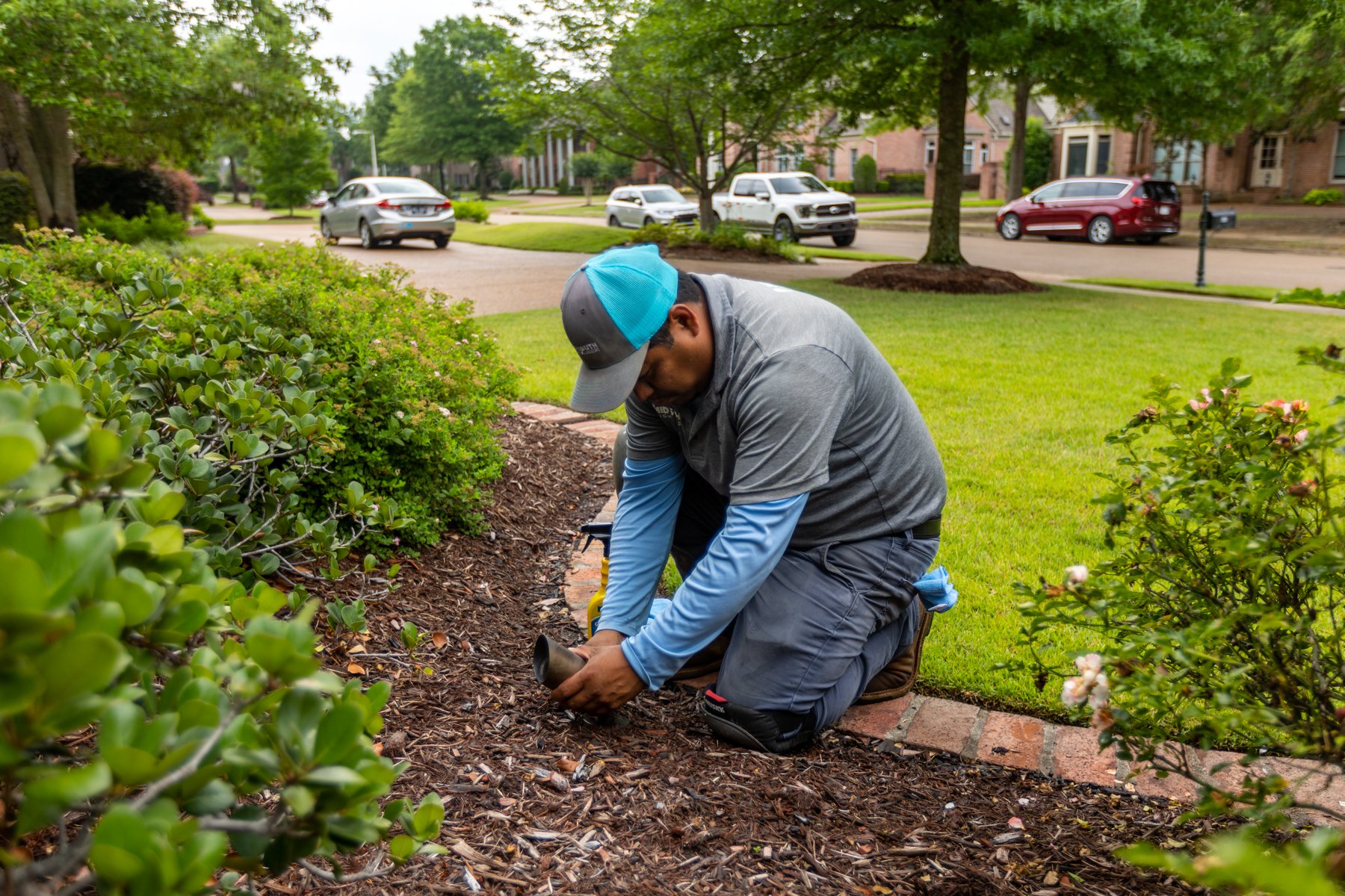 outdoor landscape lighting maintenance team installing LEDs