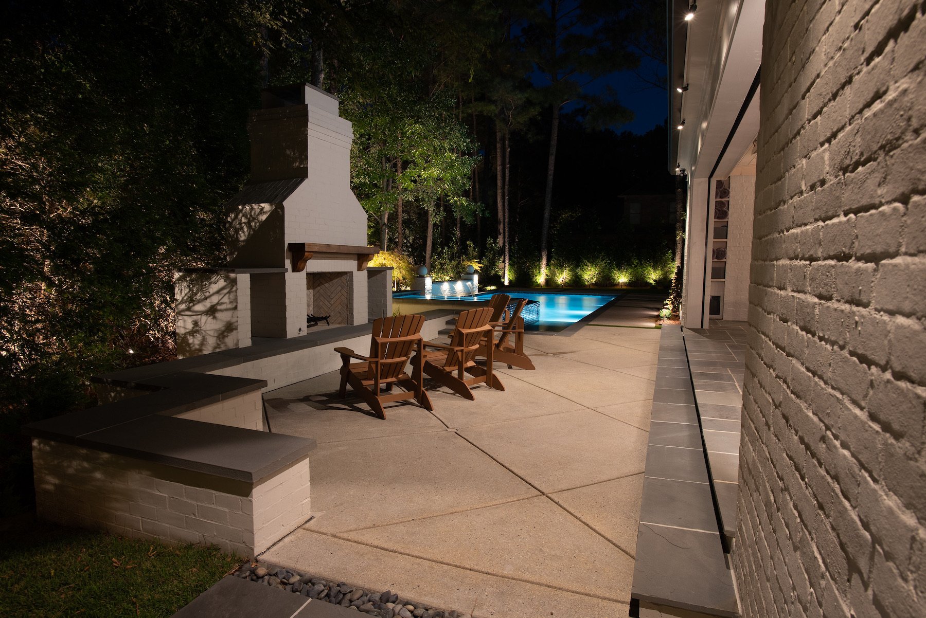 Outdoor lighting highlighting features in yard