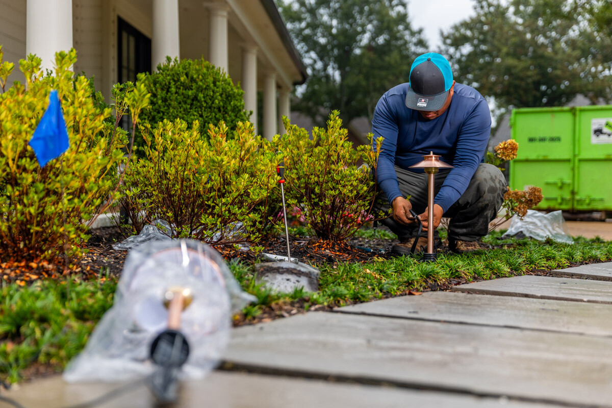 Residential landscape lighting crew installation wiring 9